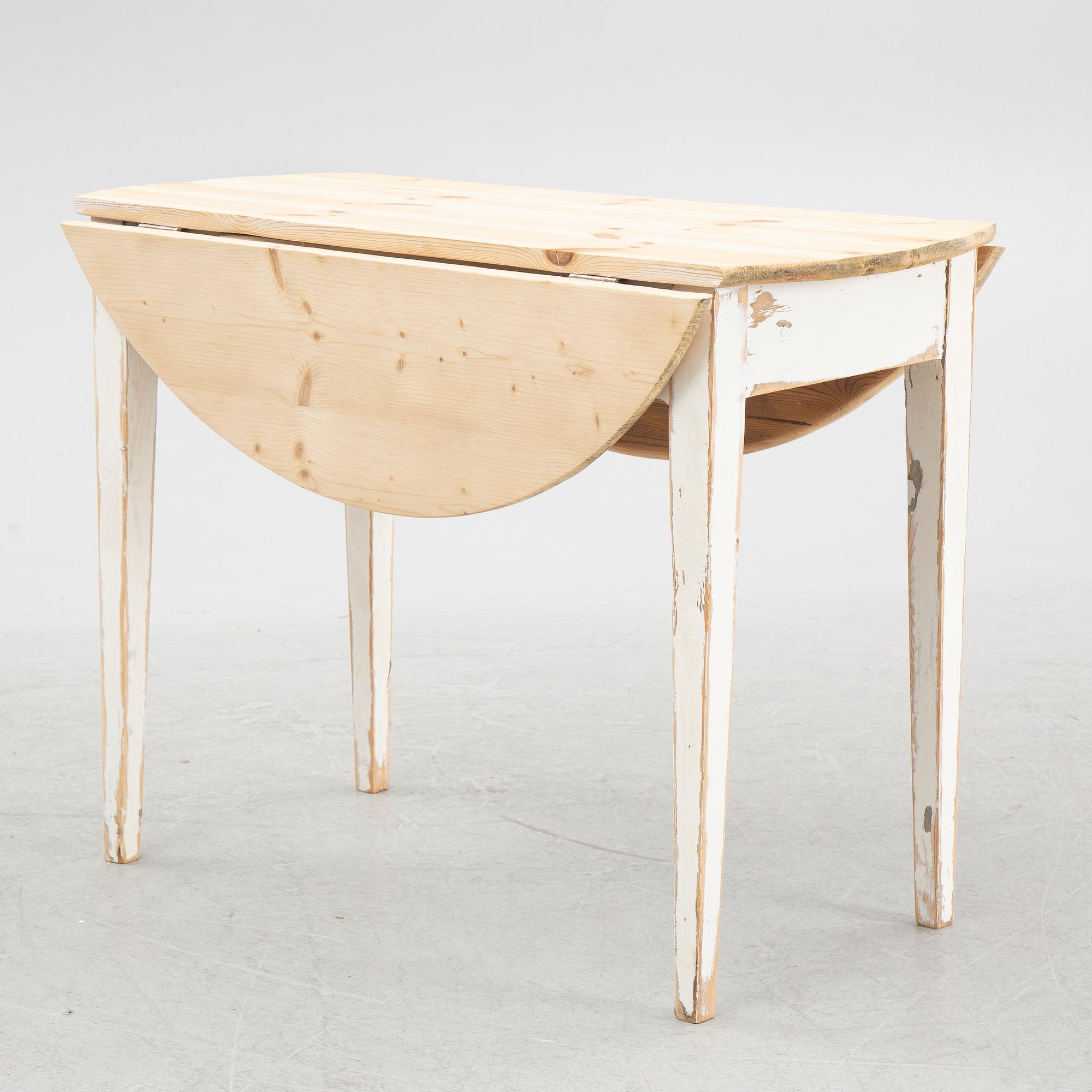 A drop-leaf table, circa 1900.