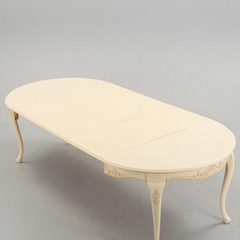 A mid 20th century rococo style dining table.