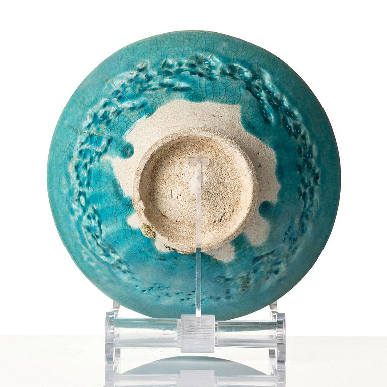 A Kashan Turquoise glazed conical pottery bowl, central Persia, 13th century.