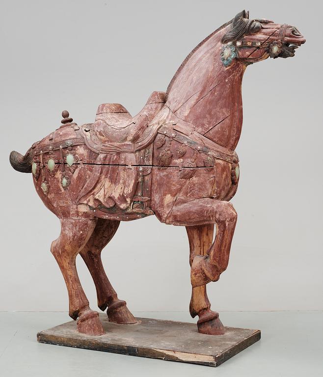 A large jade and agathe inlayed wooden carparisoned sculpture of a horse, presumably Ming dynasty.