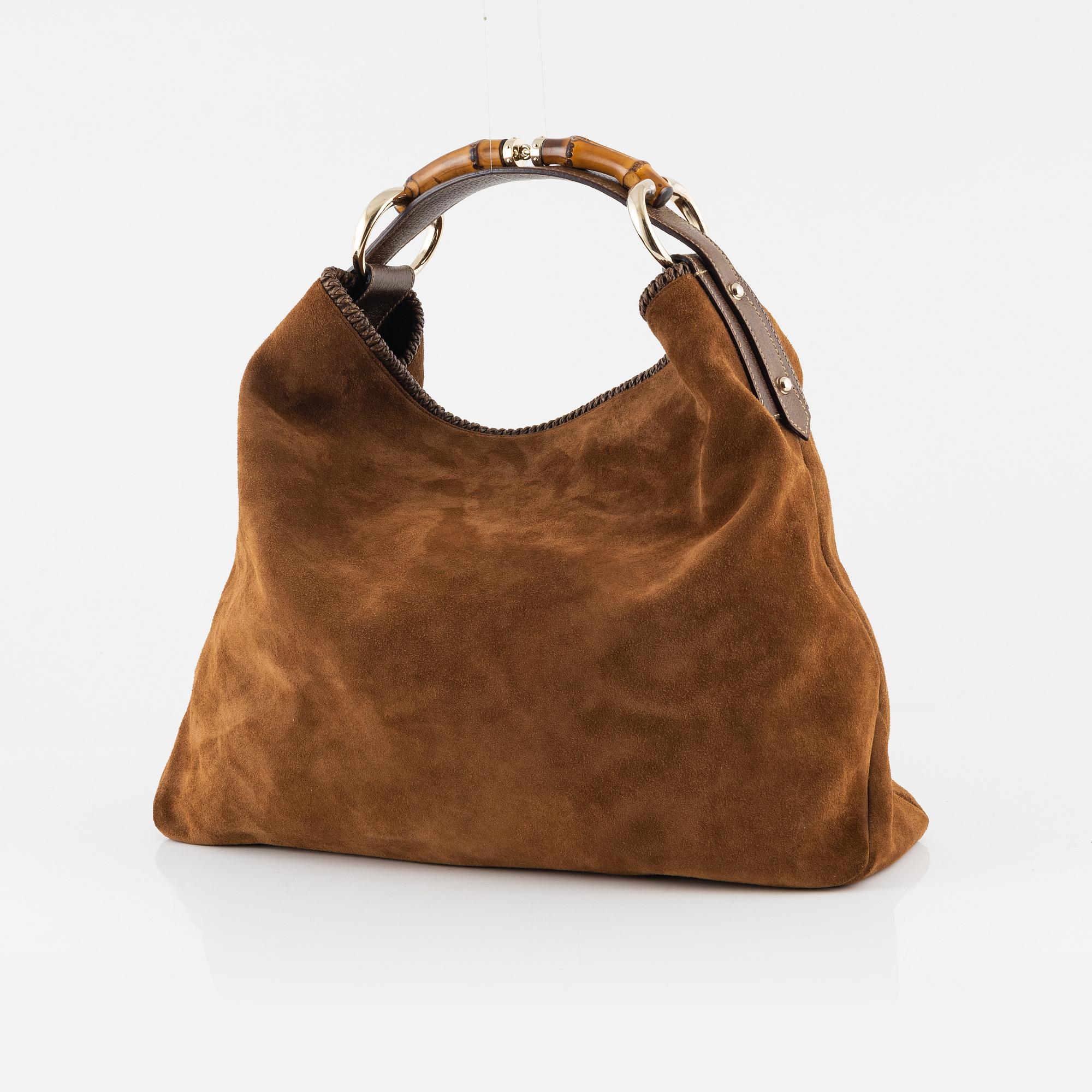 Gucci a suede and bamboo hobo bag. Bukowskis