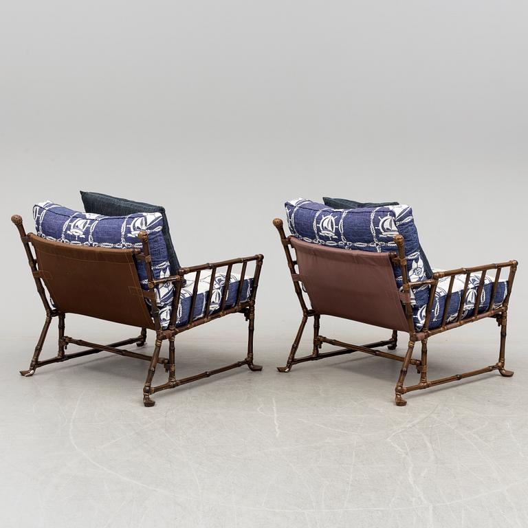 A Pair of contemporary garden easy chairs in metal imitating bamboo.