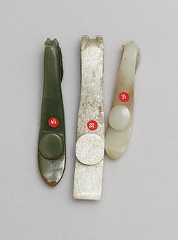 A set with three archaistic nephrite belt buckles, Qing dynasty.