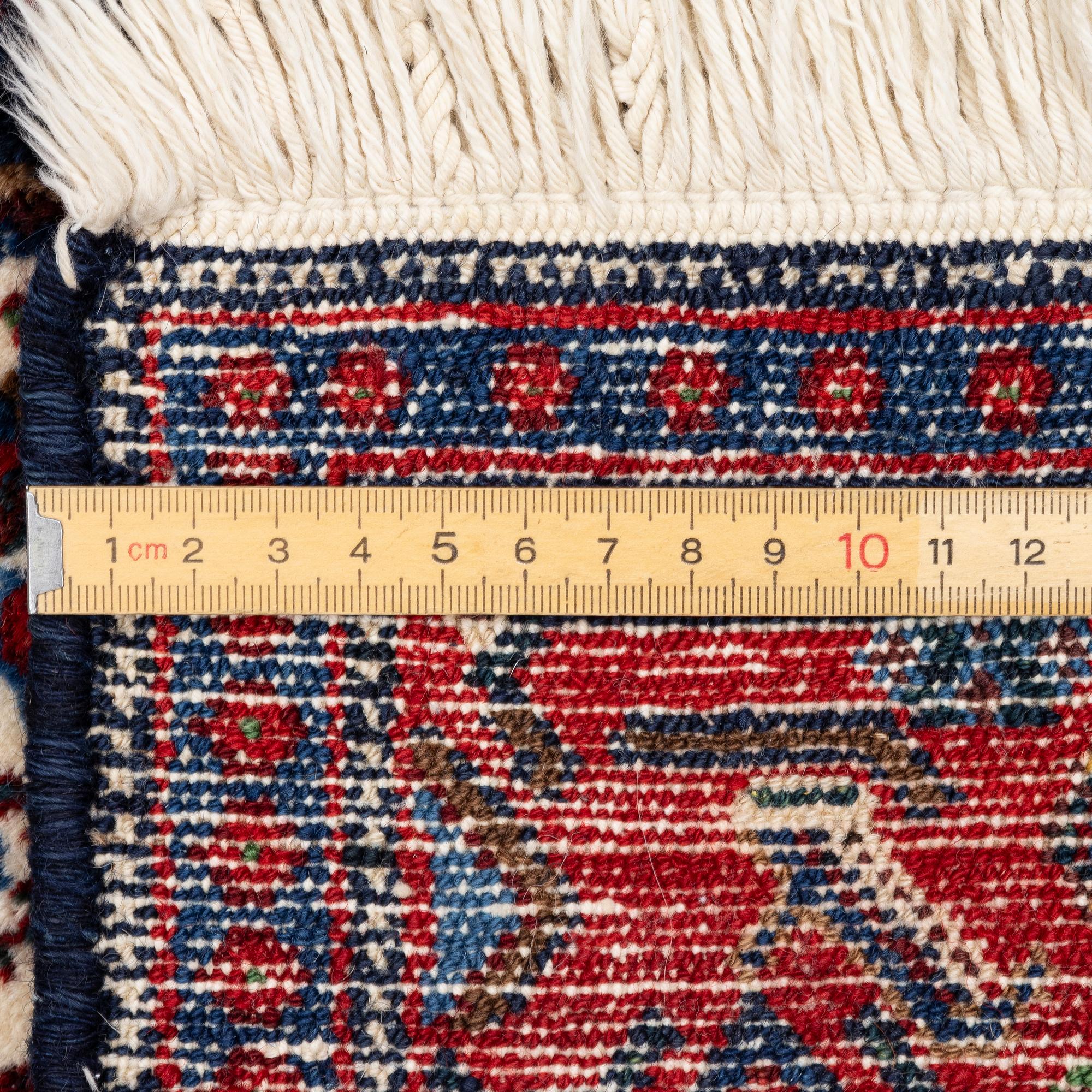 A Senneh rug, c. 160 x 117 cm.