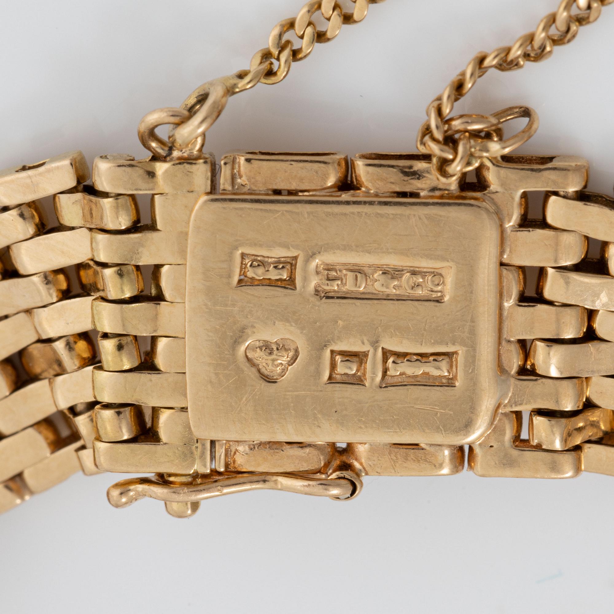 Armband med berlocker guld 18K guld.