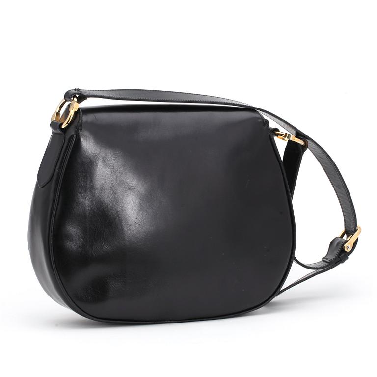 CÉLINE, a black leather shoulder bag.