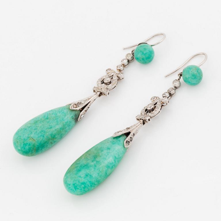 A pair of platinum earrings with amazonite.