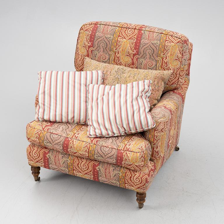 A Howard armchair with ottoman.