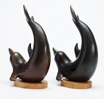 Two Gunnar Nylund stoneware figures of dolphins, Rörstrand.