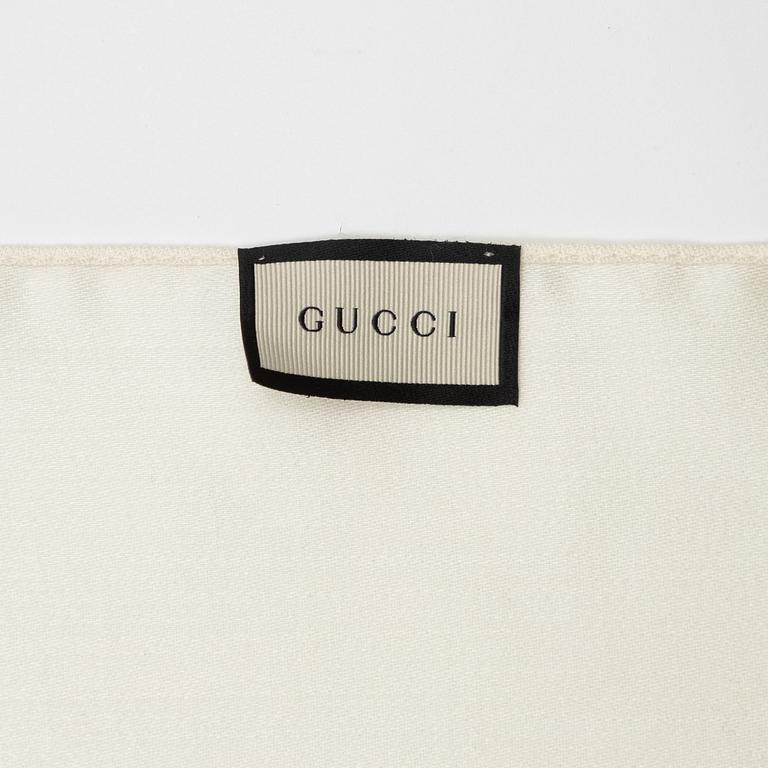 Gucci, a wool and silk mix "GG" jaquard shawl.