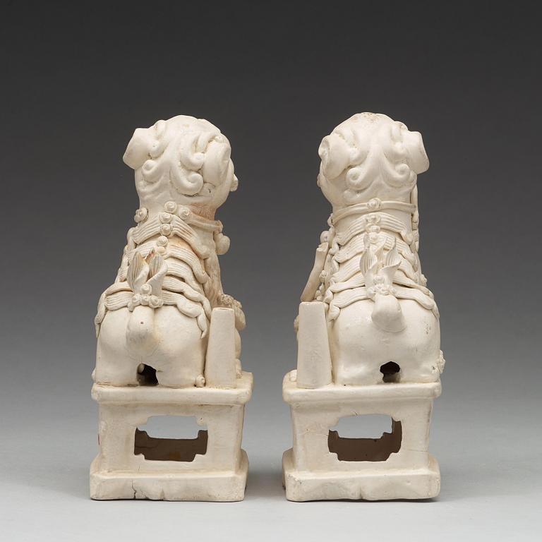 A pair of blanc de chine/bisquit porcelain joss stick holders, Transition, 17th Century.