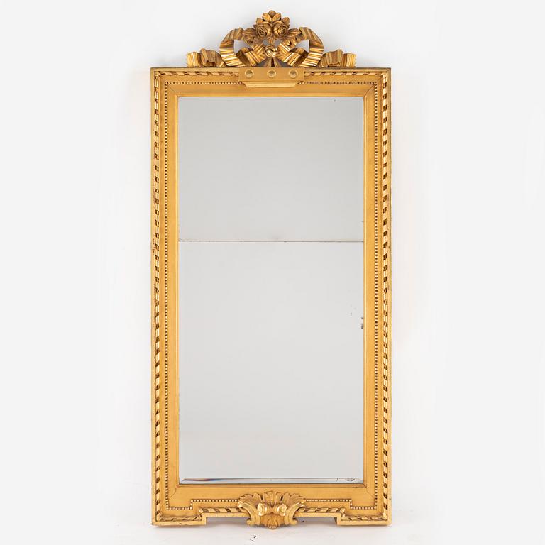 A giltwood and parcel-gilt gustavian mirror by J. Åkerblad (Master in Stockholm 1758-1799).