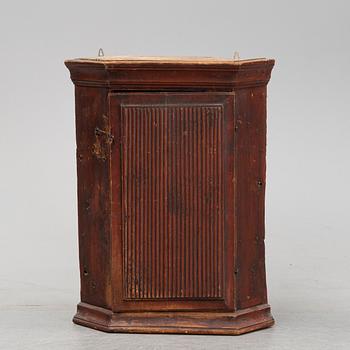 A Swedish painted corner cabinet, 19th century.