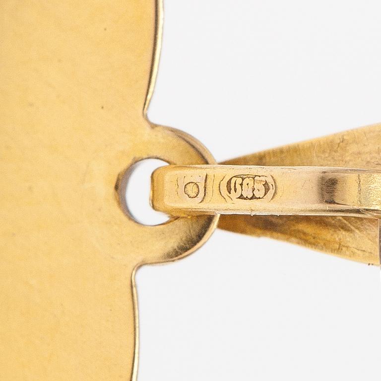 A 14K gold heart shaped pendatn with a rose in enamel.