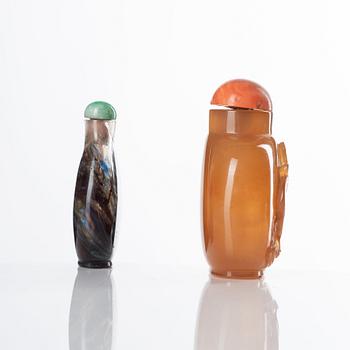 Two Chinese snuff bottles with stoppers, 20th Century.