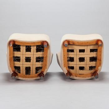 A pair of mid-20th century armchairs.