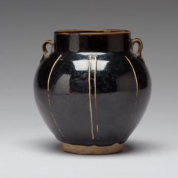 A Henan black glazed ribbed jar, Song dynasty (960-1279).