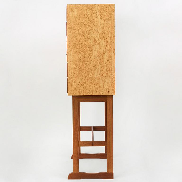 Josef Frank, a birch burrwood and padouck cabinet on stand, model 2215, Svenskt Tenn Sweden probably 1960-70's.