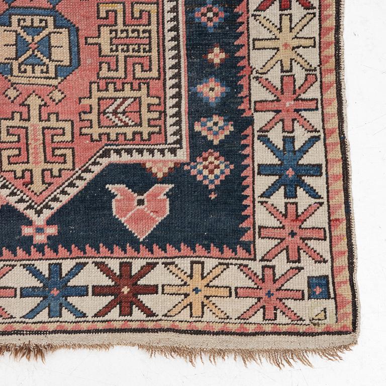 A Caucasian rug, c. 320 x 160 cm.