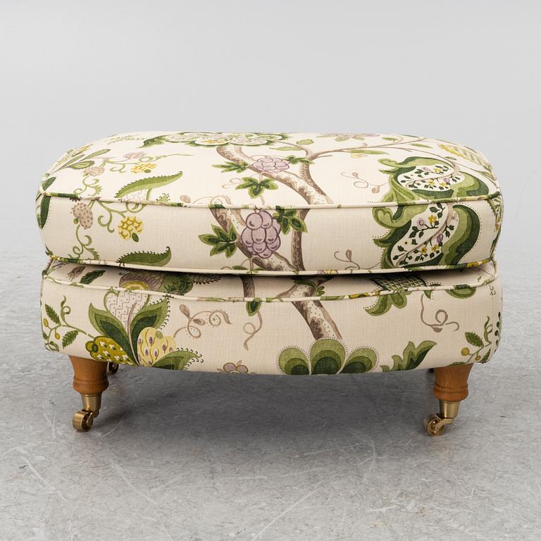 A 'Howard' armchair with footstool, Englesson.