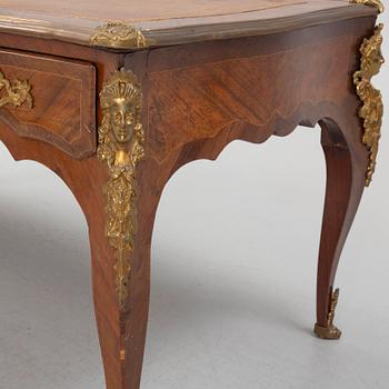 A French Louis XV-style rosewood marquetry 'Bureau plat aux bustes de femmes", late 19th century.