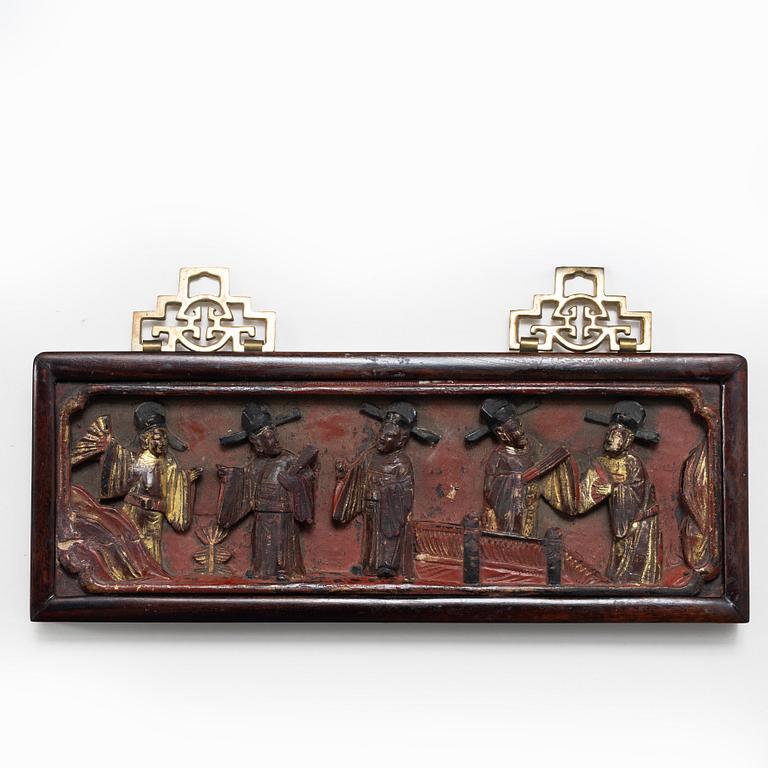 Three Chinese lacquer and wooden panels, two silk embroideries, first half of the 20th century.