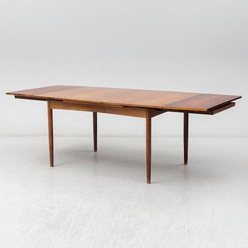 A Danish rosewood dining table, six chairs and a pair of armchairs, 1950's/60's.