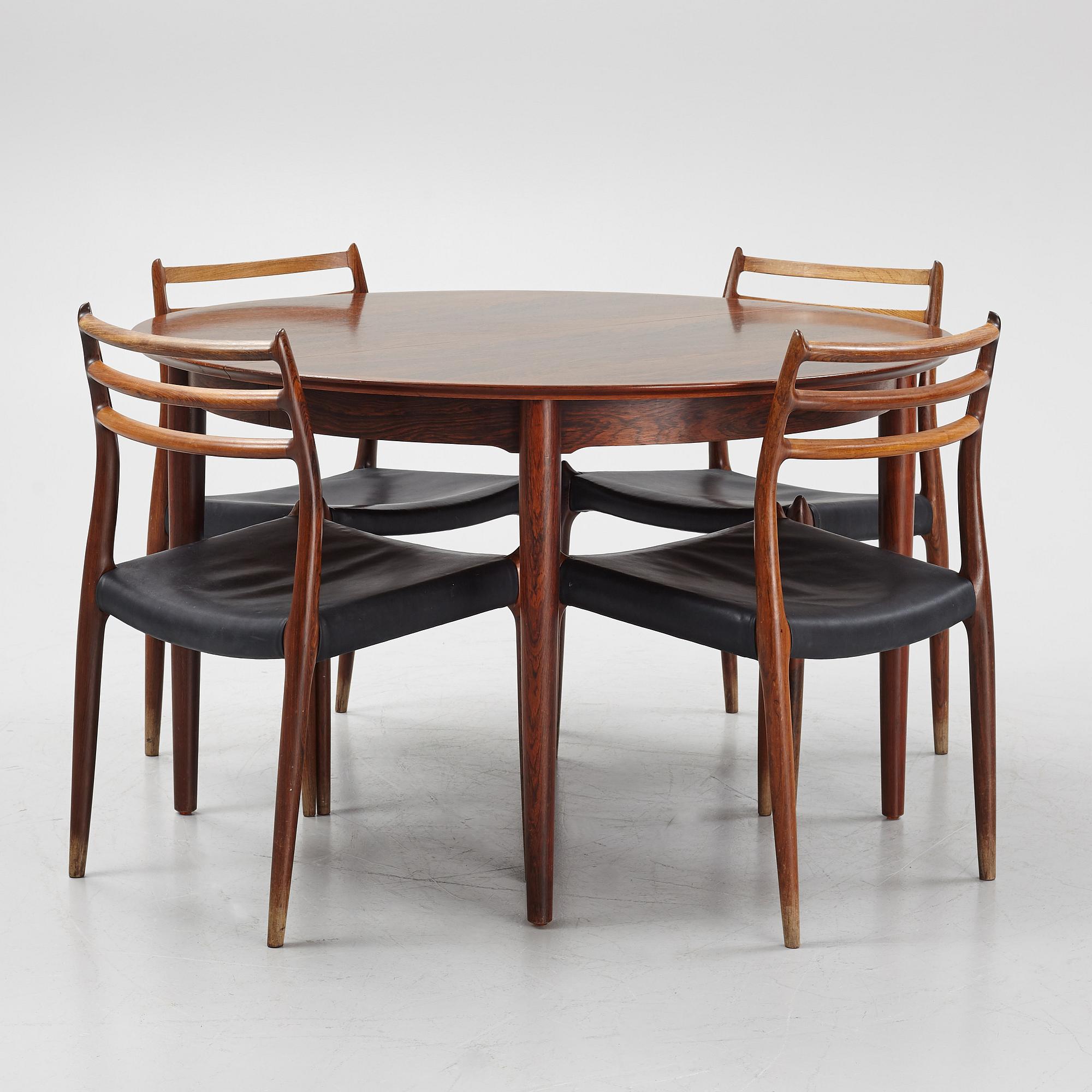 Niles Otto Møller, a rosewood veneered table with four chairs, JL Møller, Denmark, 1950's/60's.