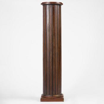 A Swedish Empire column-shaped cabinet, first part 19th century.