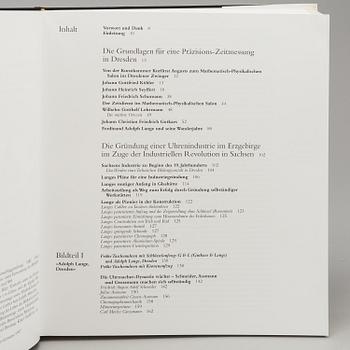 A set of 5 watch books.