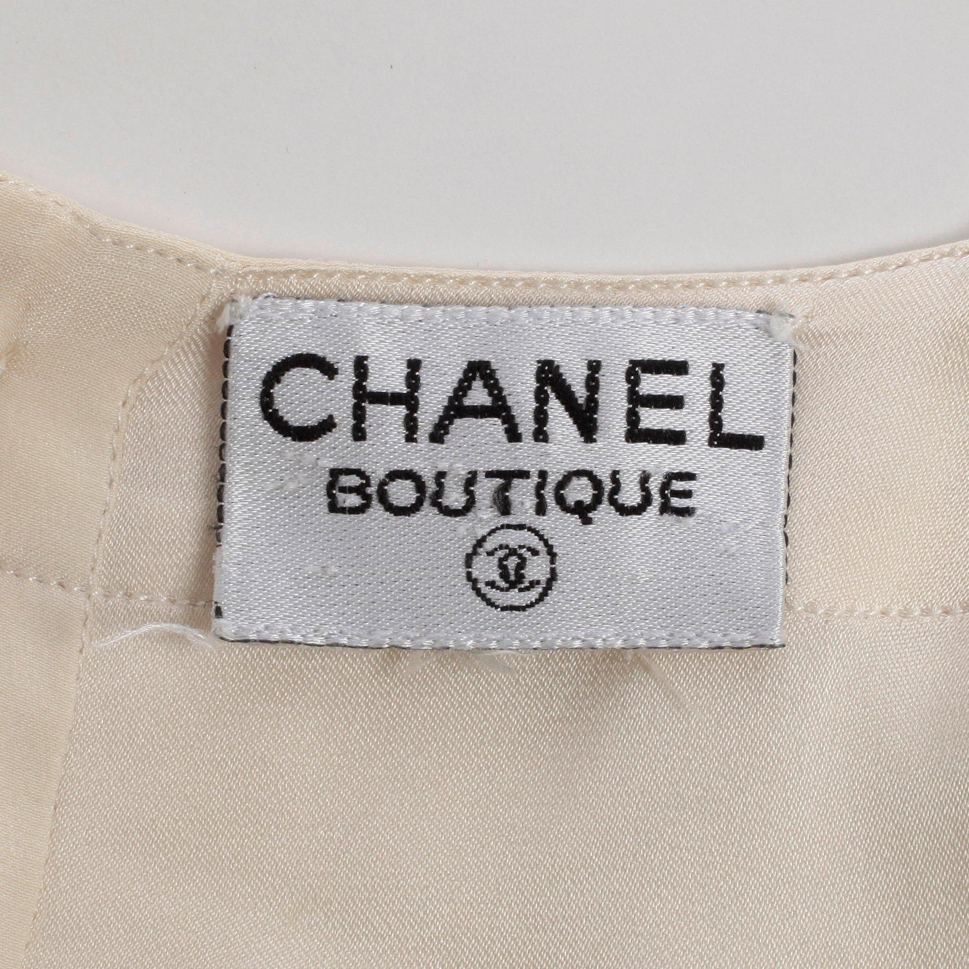 CHANEL, a white silk shirt.