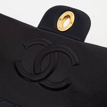 Chanel a black leather and gold hardware 'Maxi flapbag', 1991-1994.