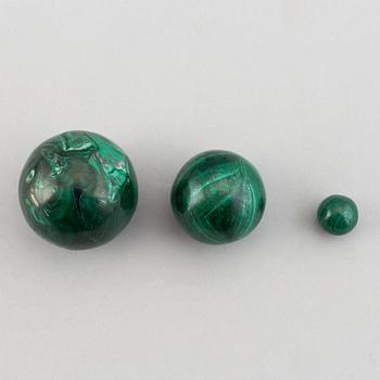 Six 20th century malachite balls and an egg.