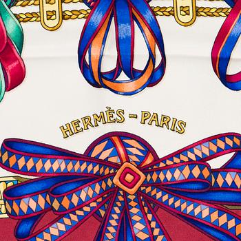 Hermès, a 'Les Rubans du Cheval' silk scarf.