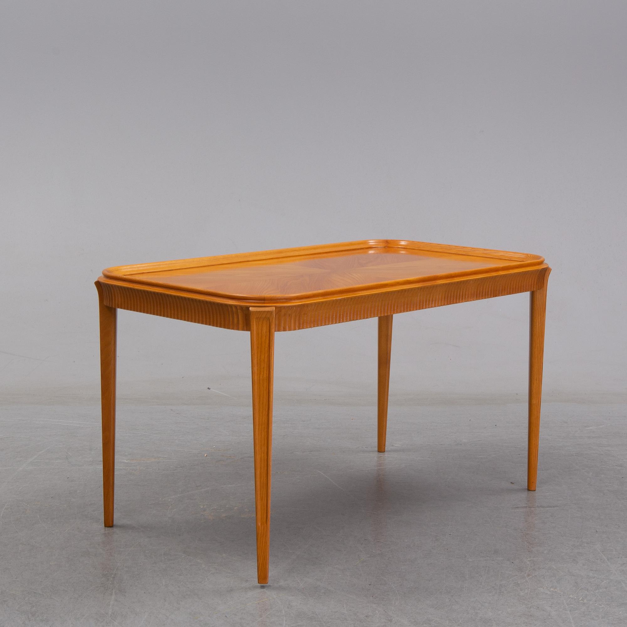 An elm Swedish Modern coffee table, dated 11 11 1947.