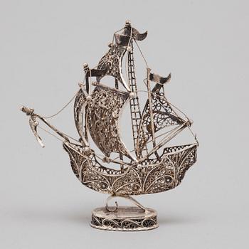 A 20TH CENTURY SILVER MINIATURE SAILING SHIP.