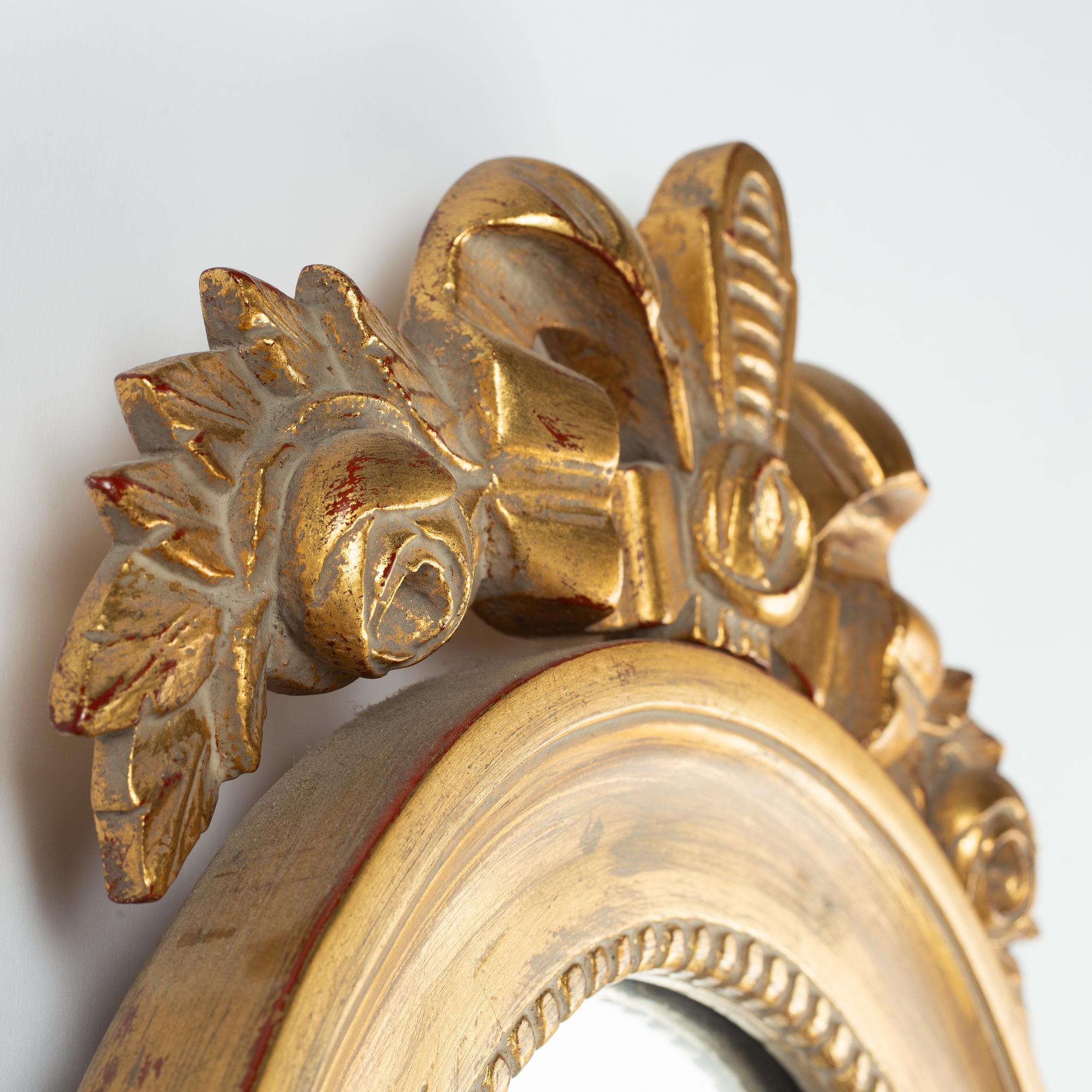 A pair of Gustavian style mirror sconces, early 20th Century.