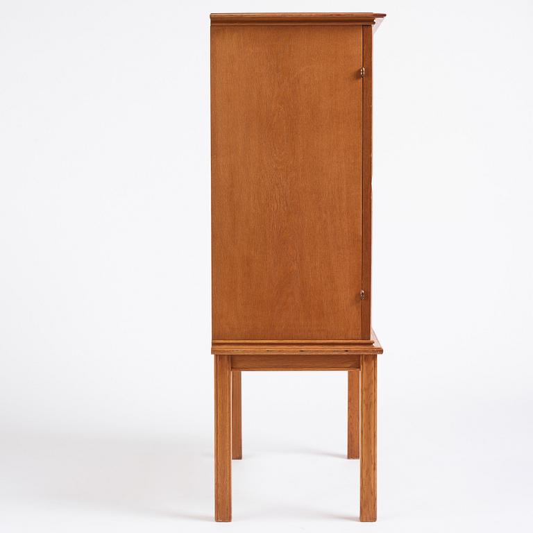 Oscar Nilsson, attributed to, a Swedish Modern oak cabinet, 1940s.