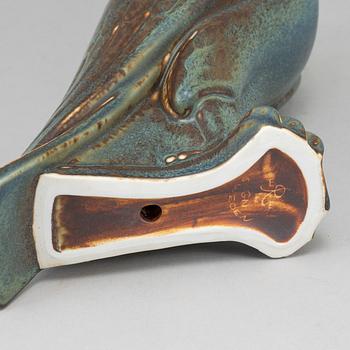 GUNNAR NYLUND, a stoneware sculpture of a falcon, Rörstrand mid 20th century.