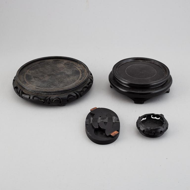 19 Chinese wooden stands, 20th century.