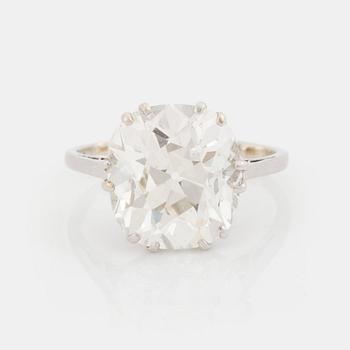 537. A platinum ring set with a cushion-formed old-cut diamond.