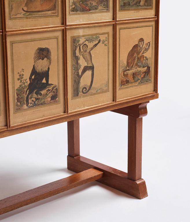 Josef Frank, 'Apskåpet' (The monkey cabinet), a rare cabinet covered with prints of different monkeys, Svenskt Tenn, Sweden ca 1941.