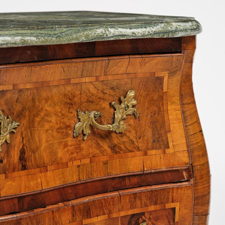A Swedish rococo parquetry commode by C. Linning (master in Stockholm 1744-79).