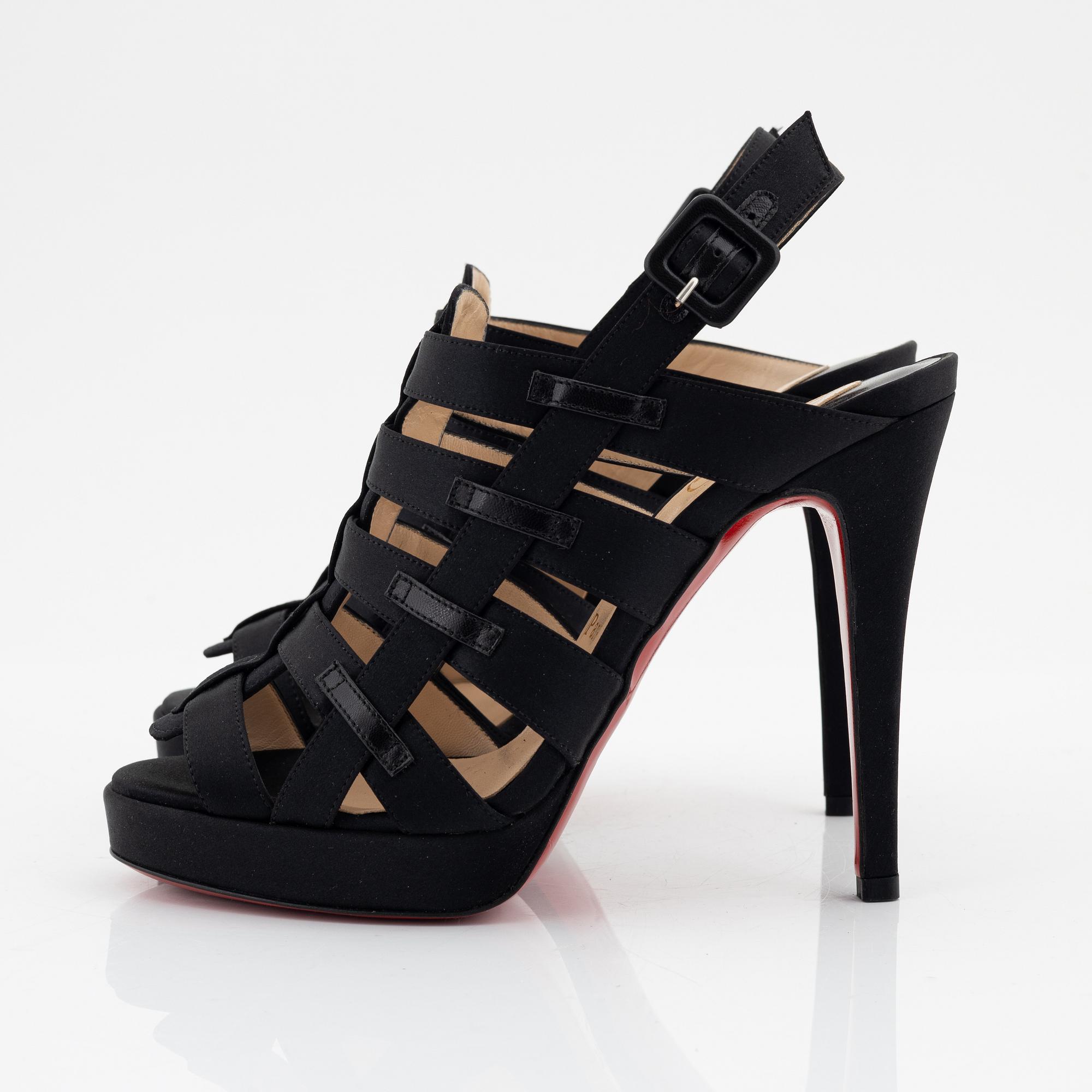 Christian Louboutin, a pair of black silk sandals, size 37 1/2.