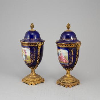 A pair of French blue enamelled vases with covers, 20th century.