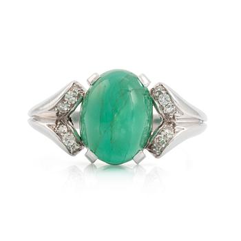 512. An 18K white gold ring set with a cabochon-cut emerald and eight-cut diamonds.
