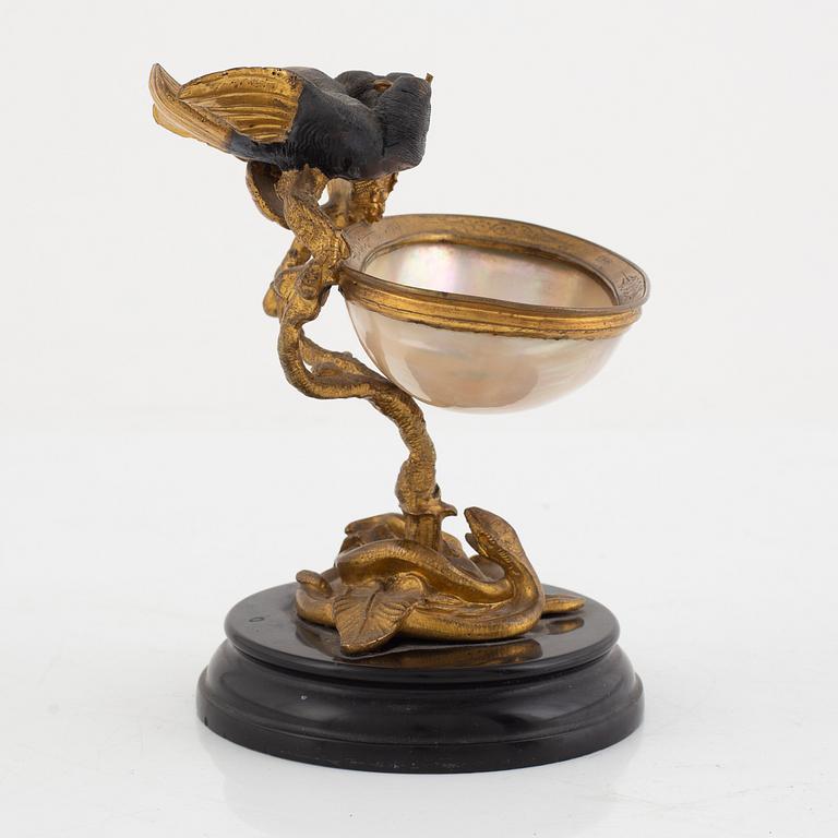 A gilt-bronze and mother of pearl stand for a pocket watch, later part 19th century.