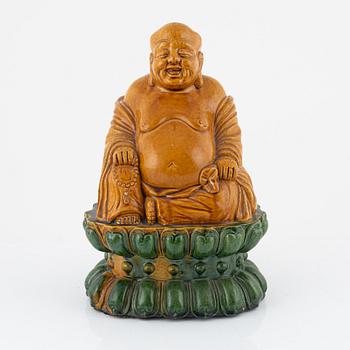 A ceramic Budai, China, 20th century.