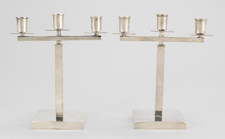 A pair of Swedish silver plated candelabra, attributed to Rolf Engströmer, by Fabriksaktiebolaget Kronsilver, 1930's.