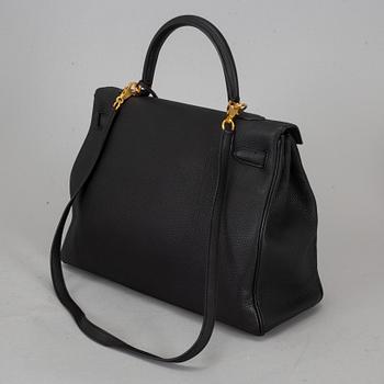 HERMÈS, a 'Kelly 35' black leather bag.